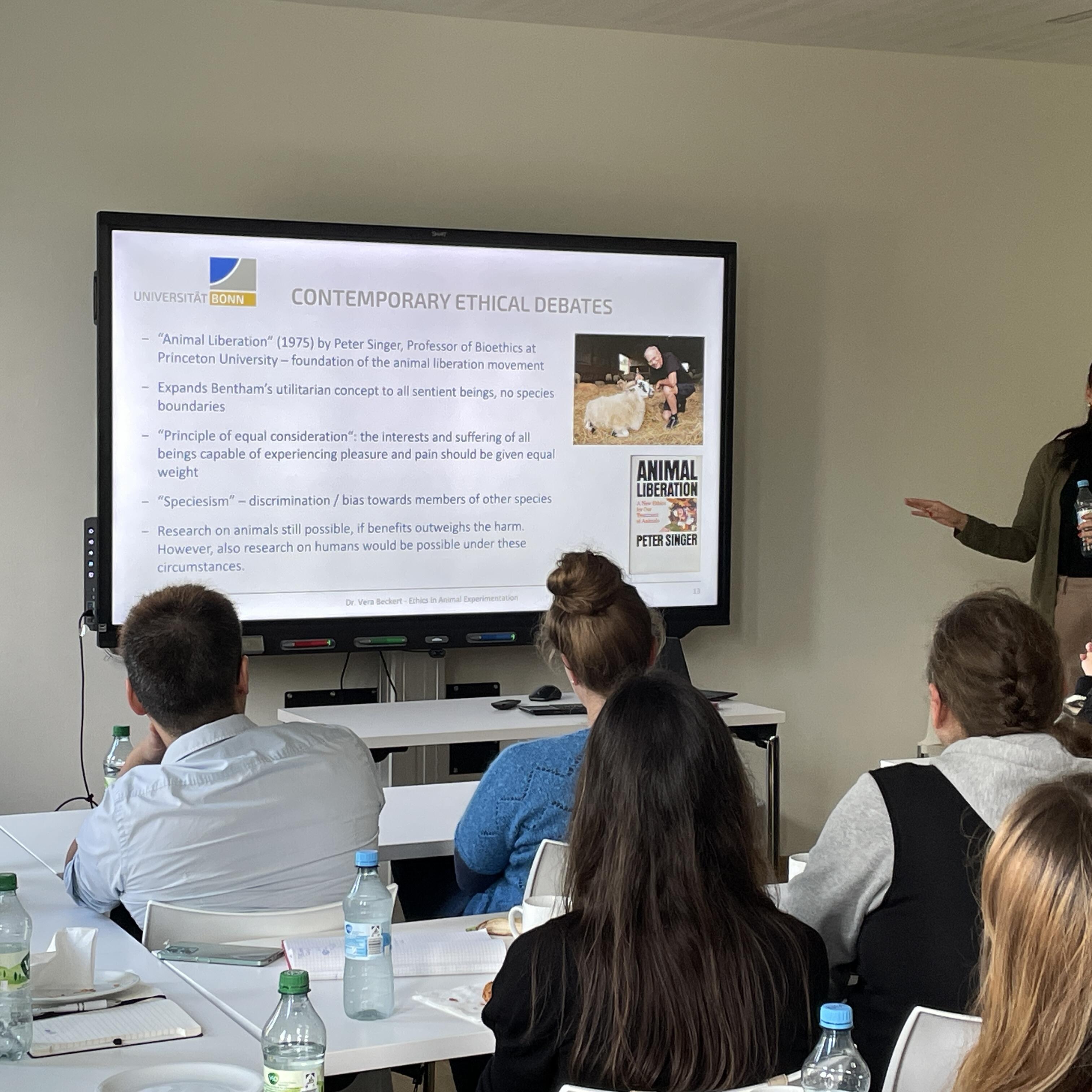 Dr. Vera Beckert is giving a presentation on animal research.