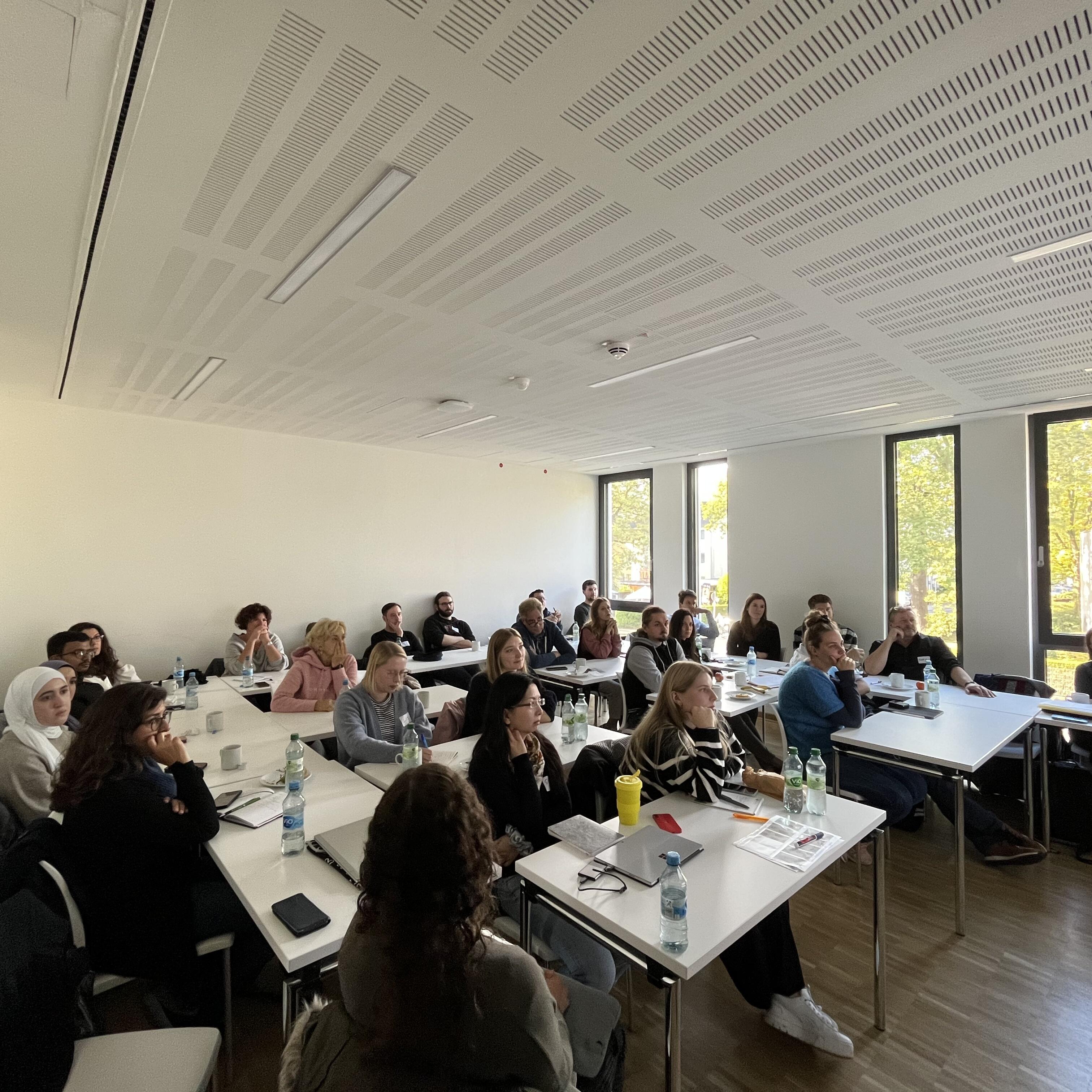 The participants are listening to the presentations carefully